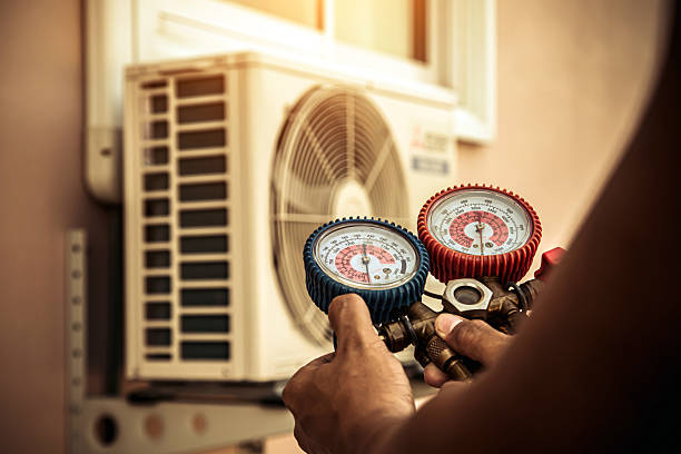 Professional Hvac technician working in De Armanville, AL